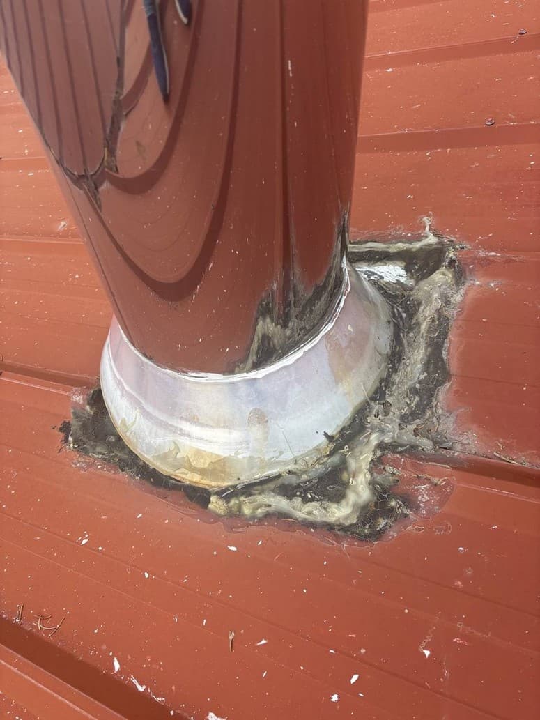 Photo 4 — Chimney jack. Old mastic cracked and pulled back.